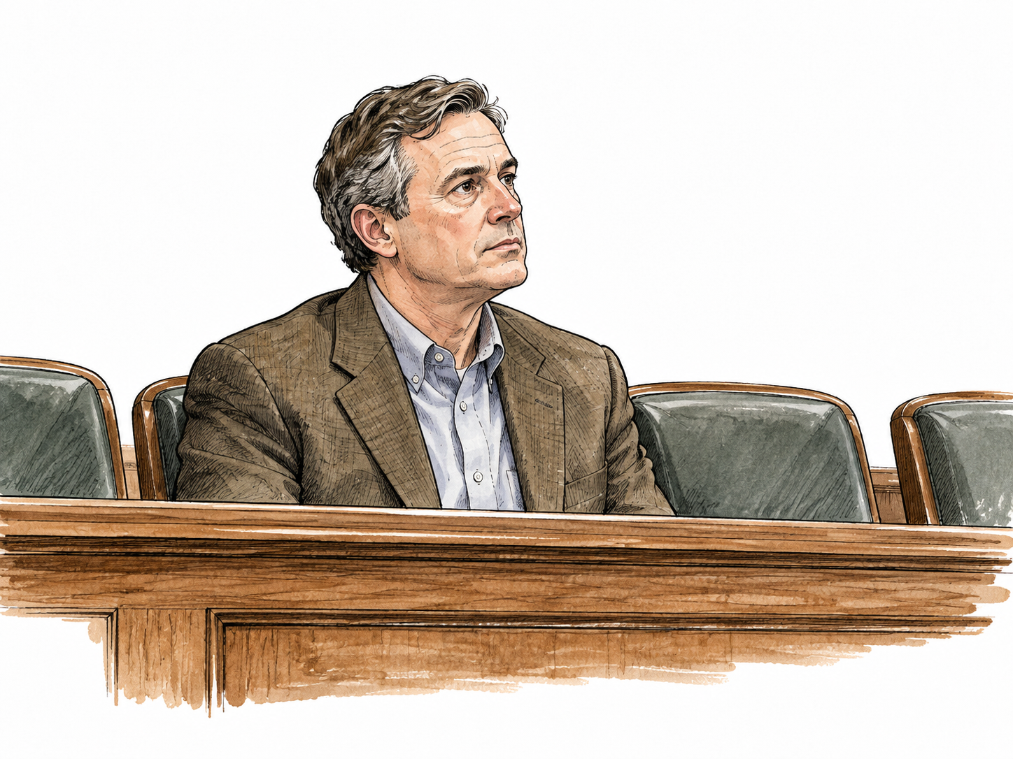 A white middle-aged male juror listens attentively from a jury bench.