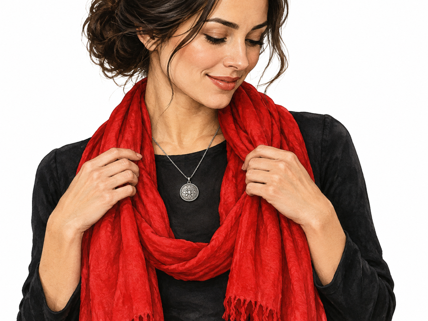 A simple silver pendant highlighted by a bright red scarf against a plain dark outfit, emphasis draws eye to pendant.
