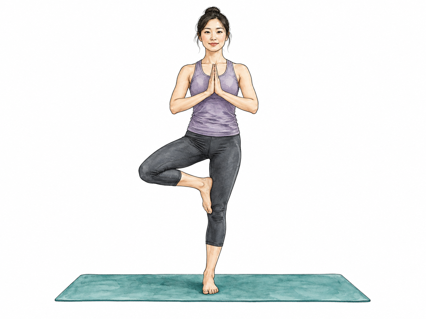 Woman balances in tree pose on a yoga mat.