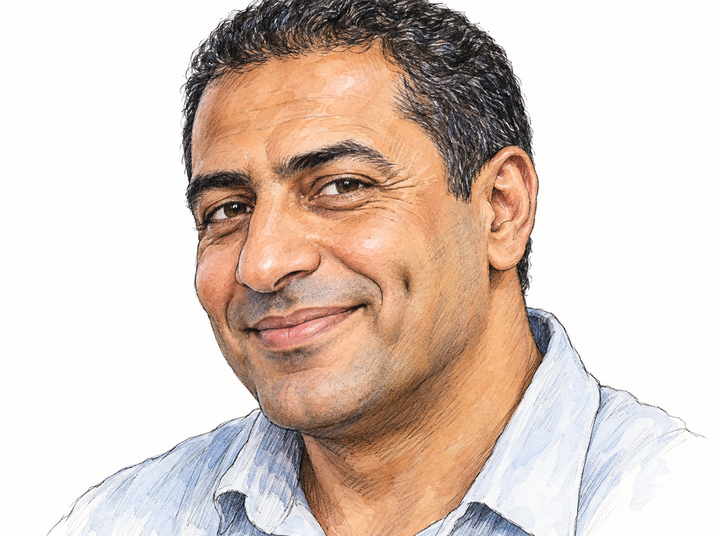 A close-up of a smiling man's face, turned slightly so a small natural cheek dimple is clearly visible beside the corner of his mouth.